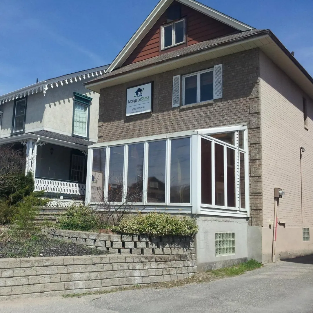 The Mortgage Sense office, a brick house with a glass sunroom and the Mortgage Sense sign out front, at 11 Bradford Street in Barrie